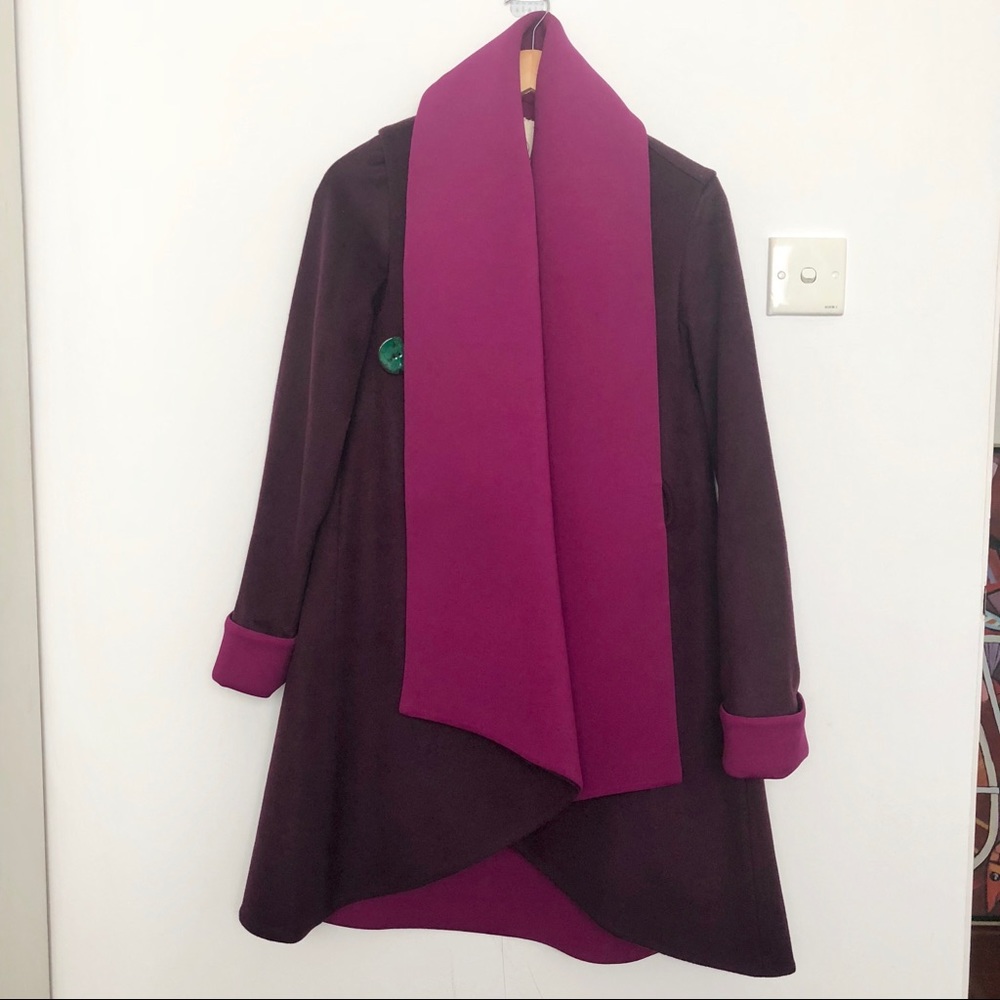 Deep purple wool coat with a fuchsia wide lapel
